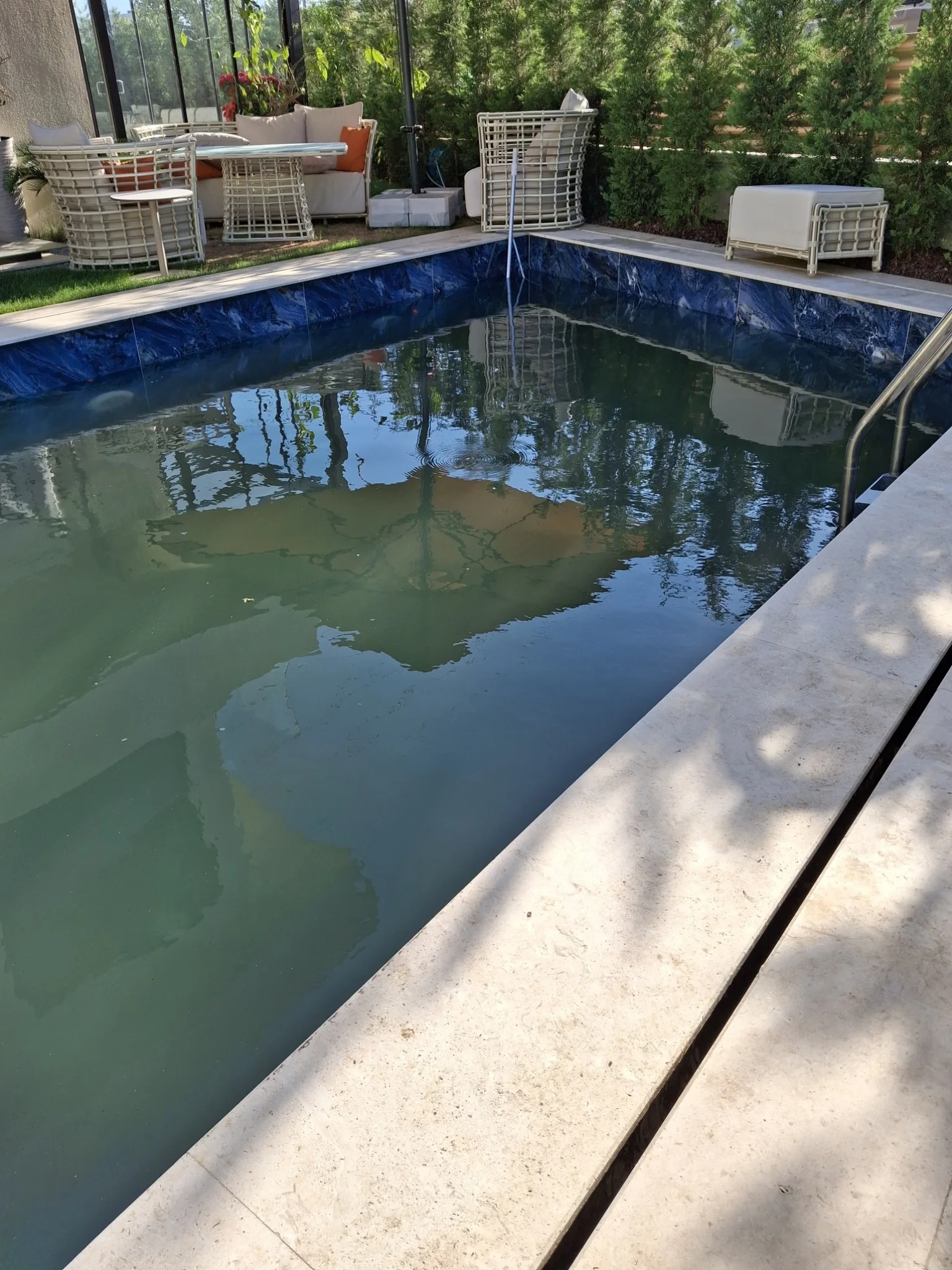 Cloudy pool water before intervention